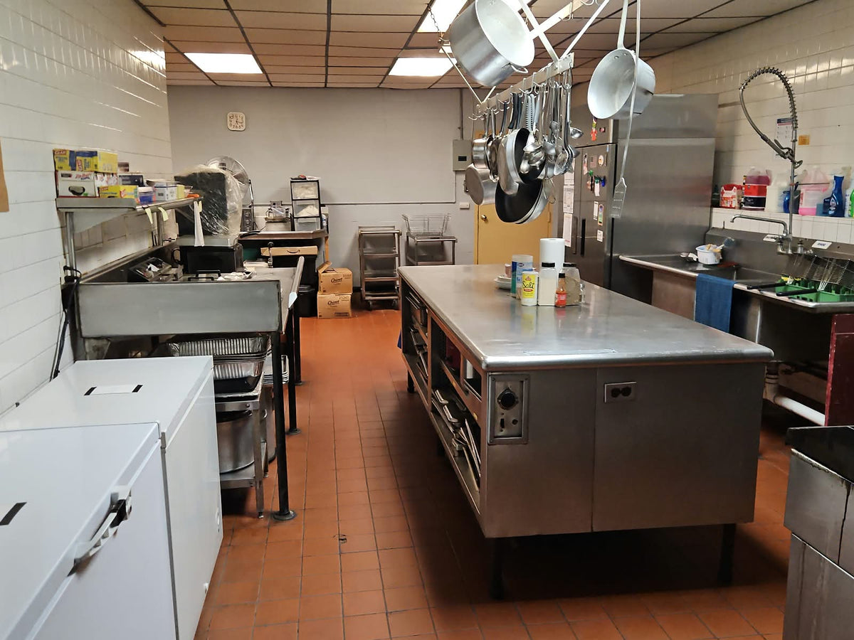 Actual commercial kitchen at Greenville Memorial VFW Post 3175, with stainless work surfaces and cookware